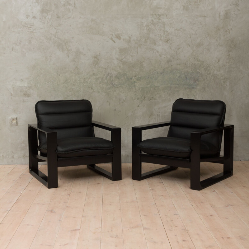 Set of 2 black lounge chairs in wood and leather by Miroslav Navratil