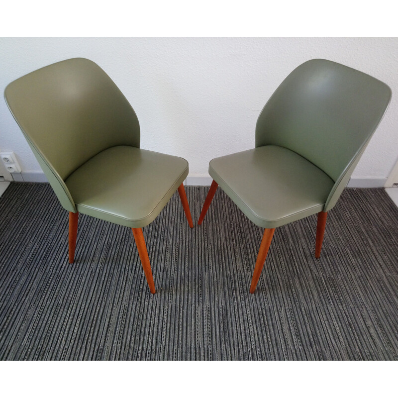 Suite de 2 chaises vintage tonneau en skai vert