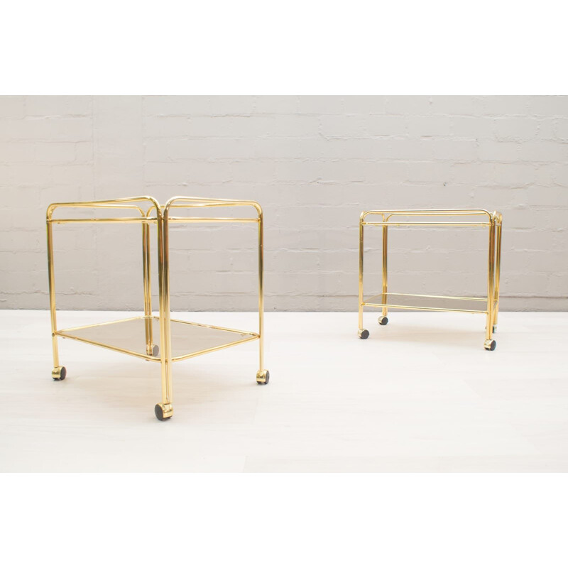 Pair of vintage serving carts in smoked glass