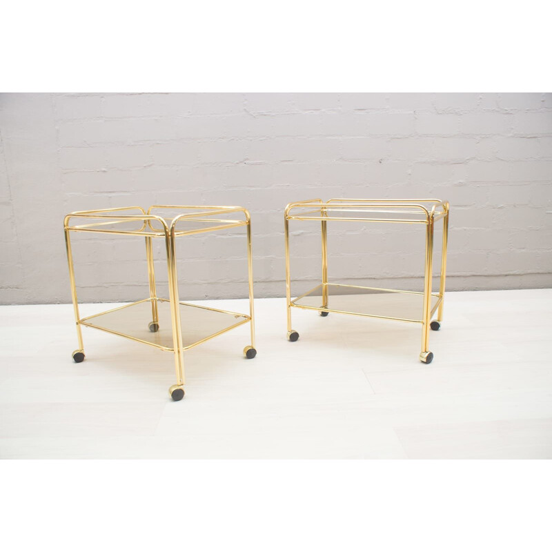 Pair of vintage serving carts in smoked glass