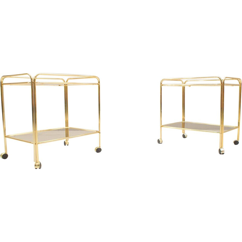 Pair of vintage serving carts in smoked glass