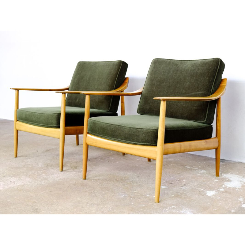 Pair of easy chairs in dark green velvet by Walter Knoll