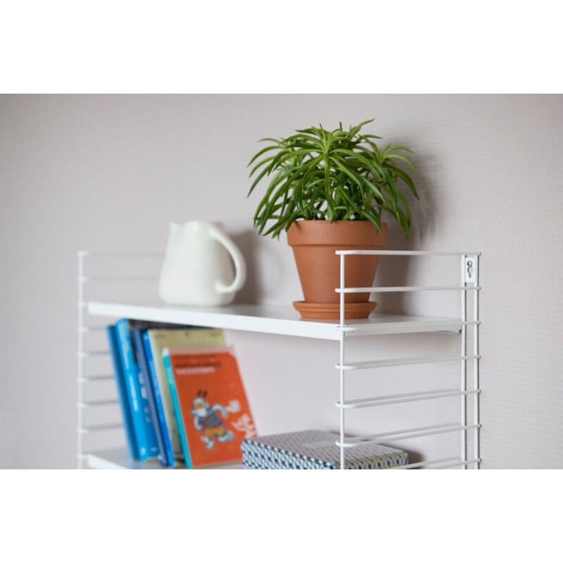 White "Tomado" shelves by Adrian Dekker 