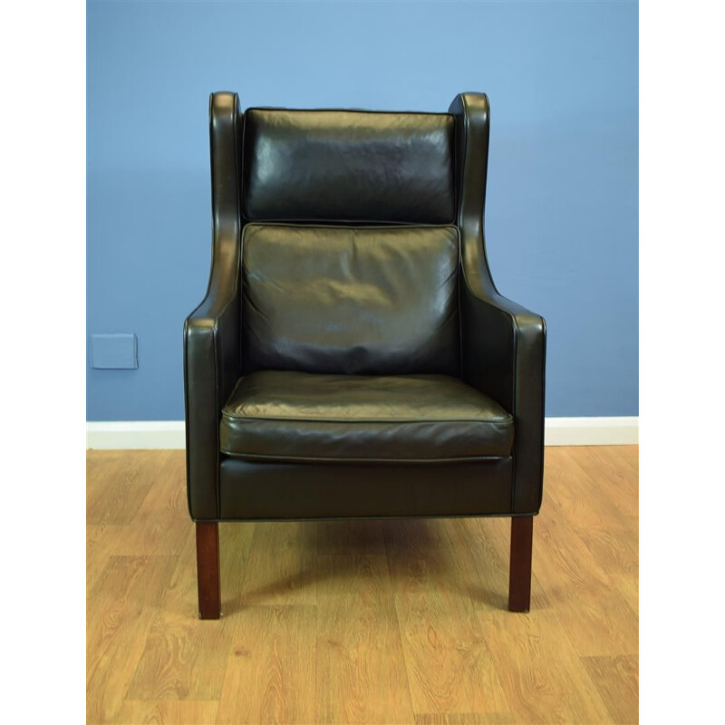 Vintage Danish wingback armchair in black leather