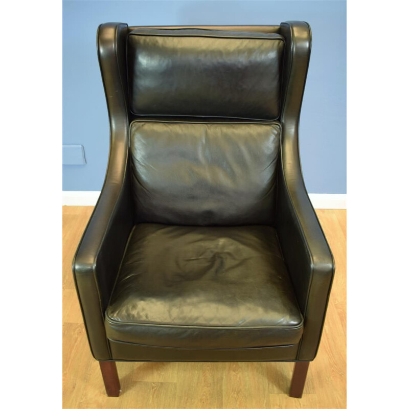 Vintage Danish wingback armchair in black leather