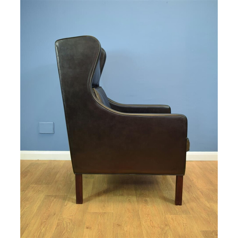 Vintage Danish wingback armchair in black leather