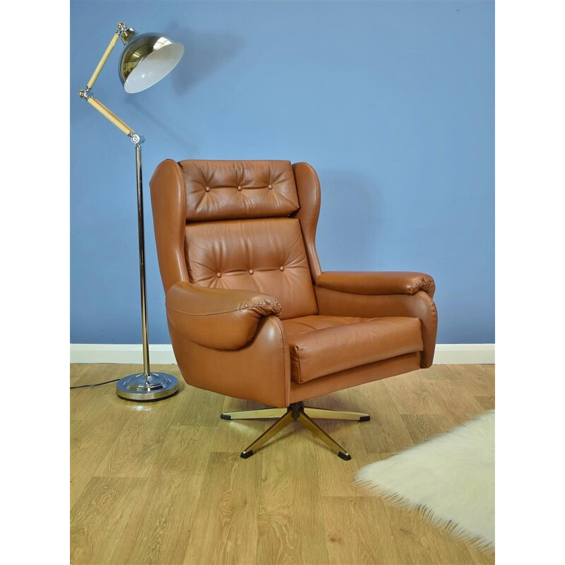 Vintage Danish swivel armchair in brown leather