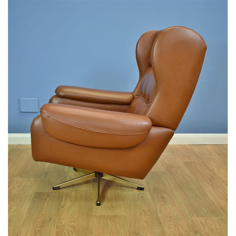 Vintage Danish swivel armchair in brown leather