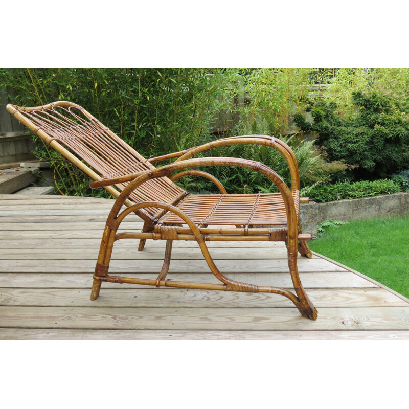 Vintage chaise lounge with footstool in cane and rattan