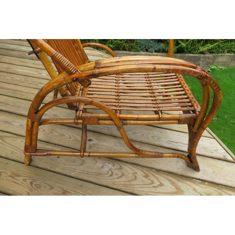 Vintage chaise lounge with footstool in cane and rattan