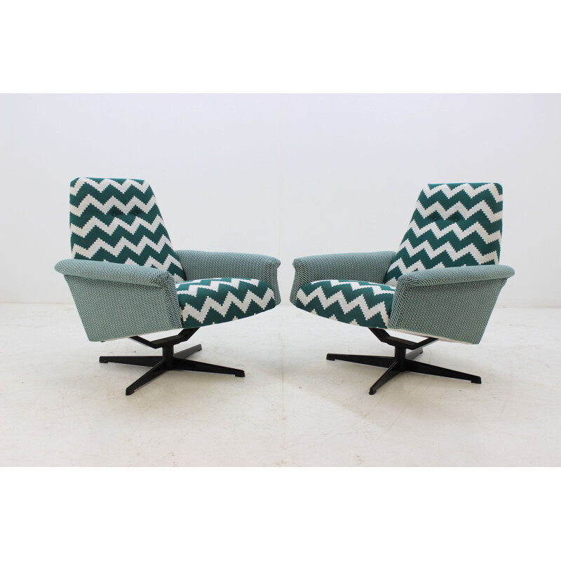 Set of 2 swivel vintage highback armchairs