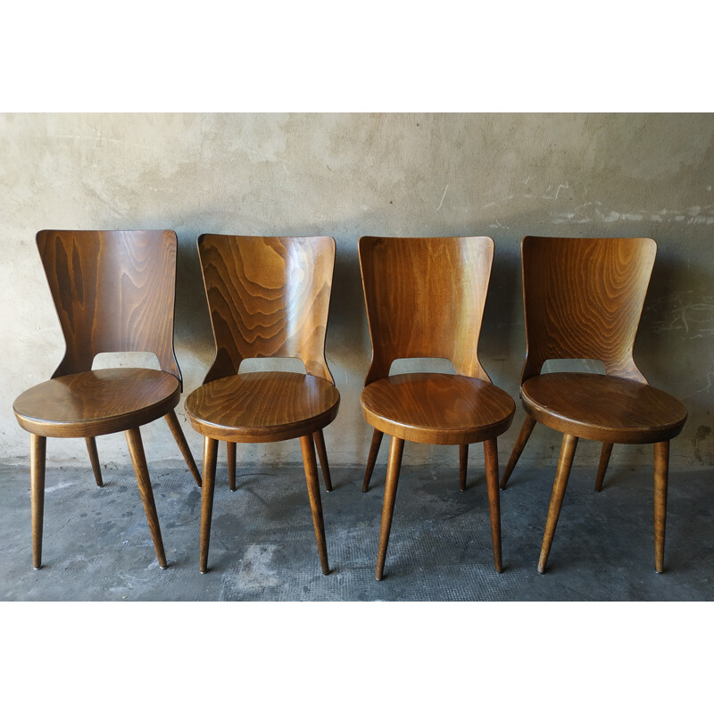 Suite de 4 chaises de bistrot "Mondor" par Baumann