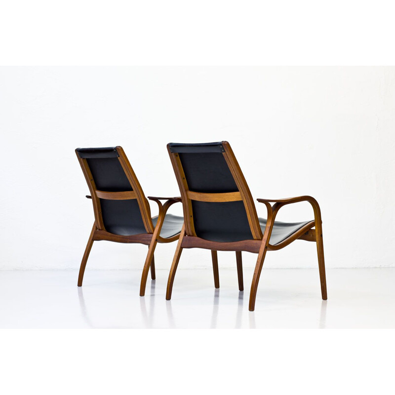 Vintage set of 2 armchairs in teak and black leather 