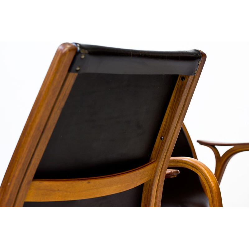 Suite de 2 fauteuils en teck et cuir noir 