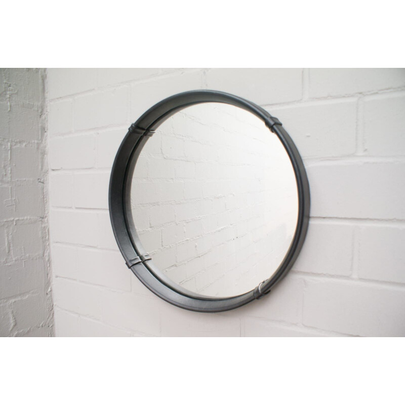 Vintage round wall mirror in leather
