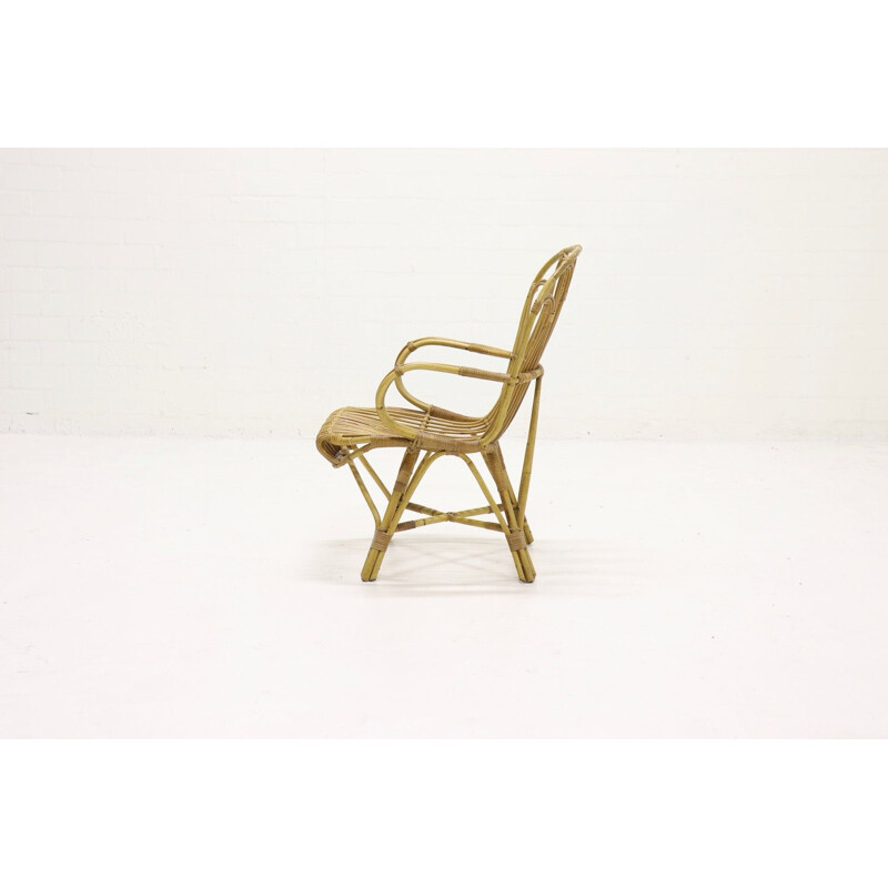 Vintage lounge chair in rattan for Rohé