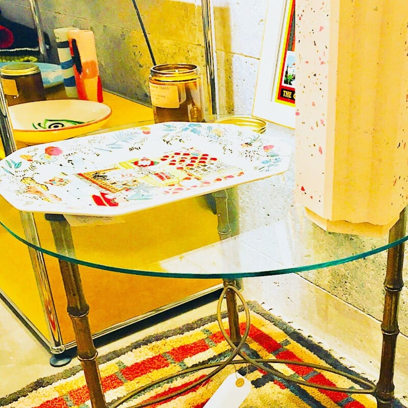 Vintage table with feet in bronze and glass top