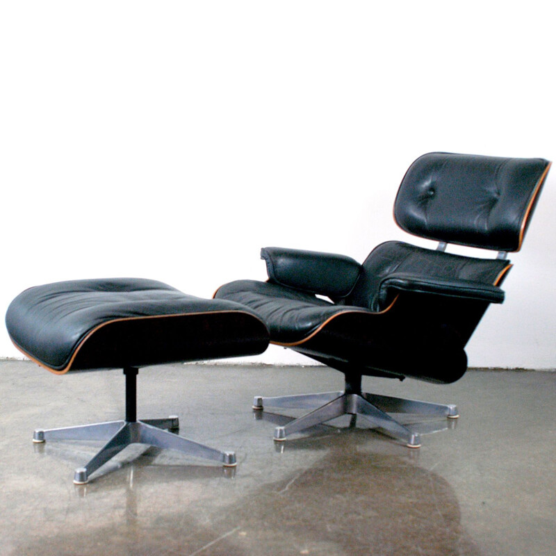 Vintage lounge chair and ottoman in rosewood by Eames for Herman Miller
