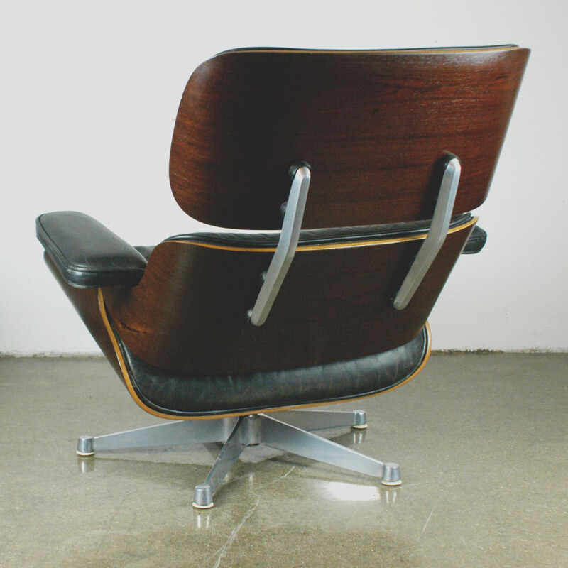 Vintage lounge chair and ottoman in rosewood by Eames for Herman Miller