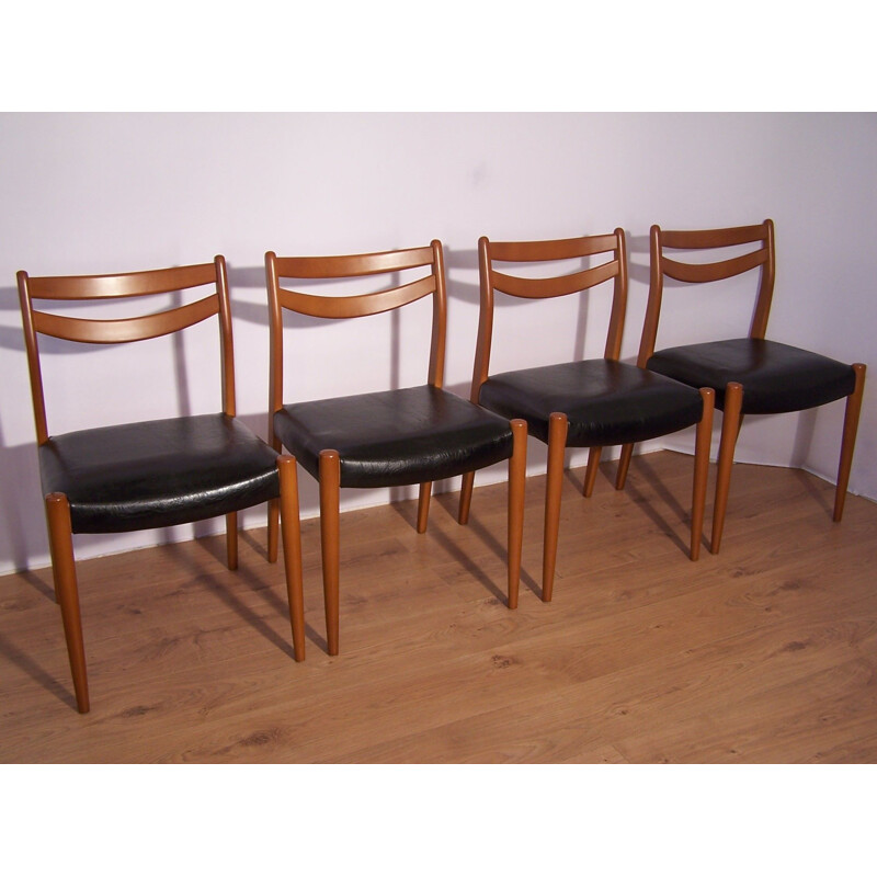 Set of 4 chairs in wood and faux black leather 1960