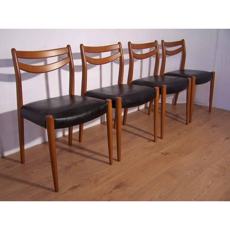 Set of 4 chairs in wood and faux black leather 1960