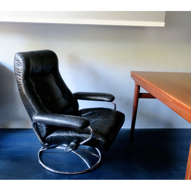 Vintage swivel recliner lounge chair in black leather