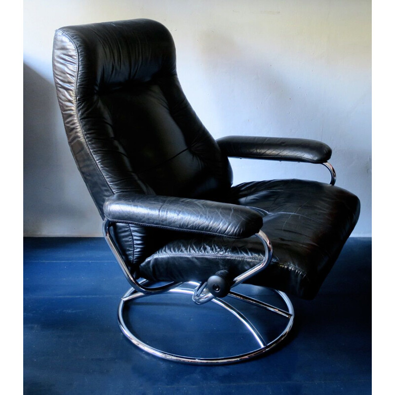Vintage swivel recliner lounge chair in black leather