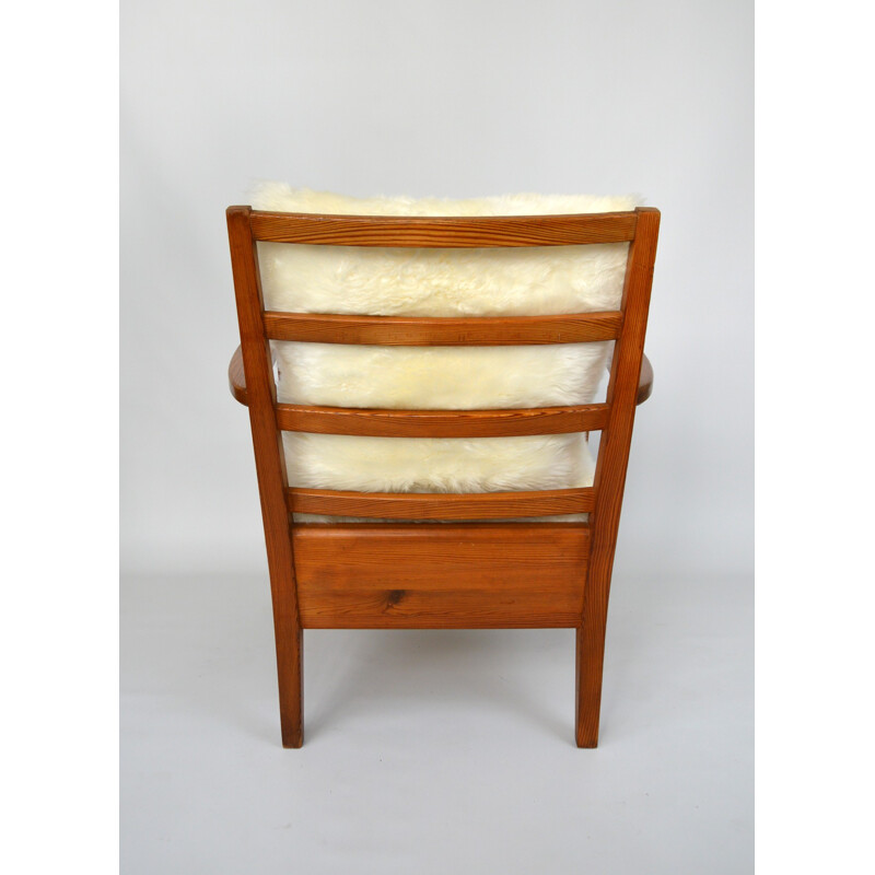 Vintage Utö-lovö armchair in pine and sheepskin by Axel Einar Hjorth, 1940