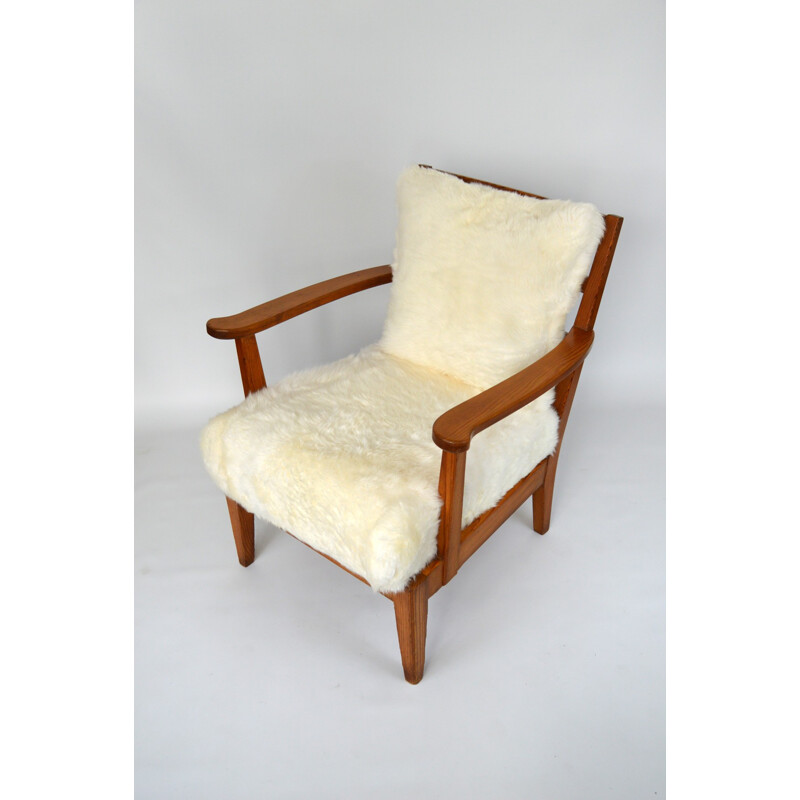 Vintage Utö-lovö armchair in pine and sheepskin by Axel Einar Hjorth, 1940