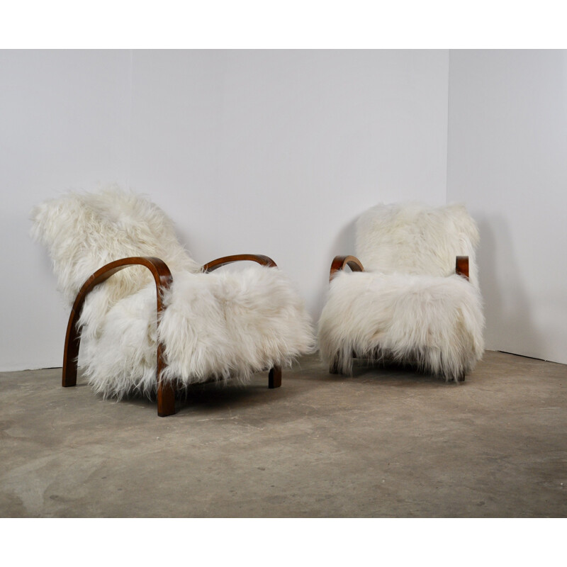 Set of 2 vintage French armchairs in sheepskin 