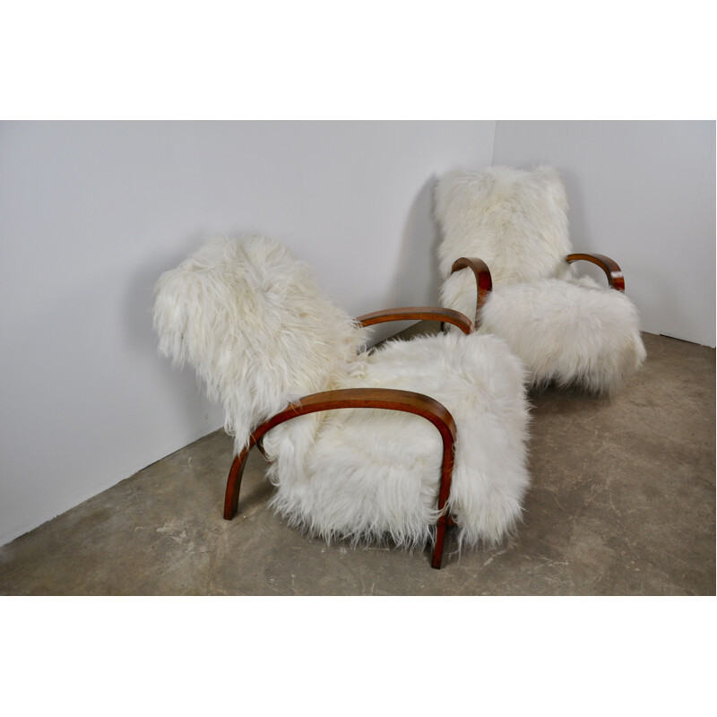 Set of 2 vintage French armchairs in sheepskin 