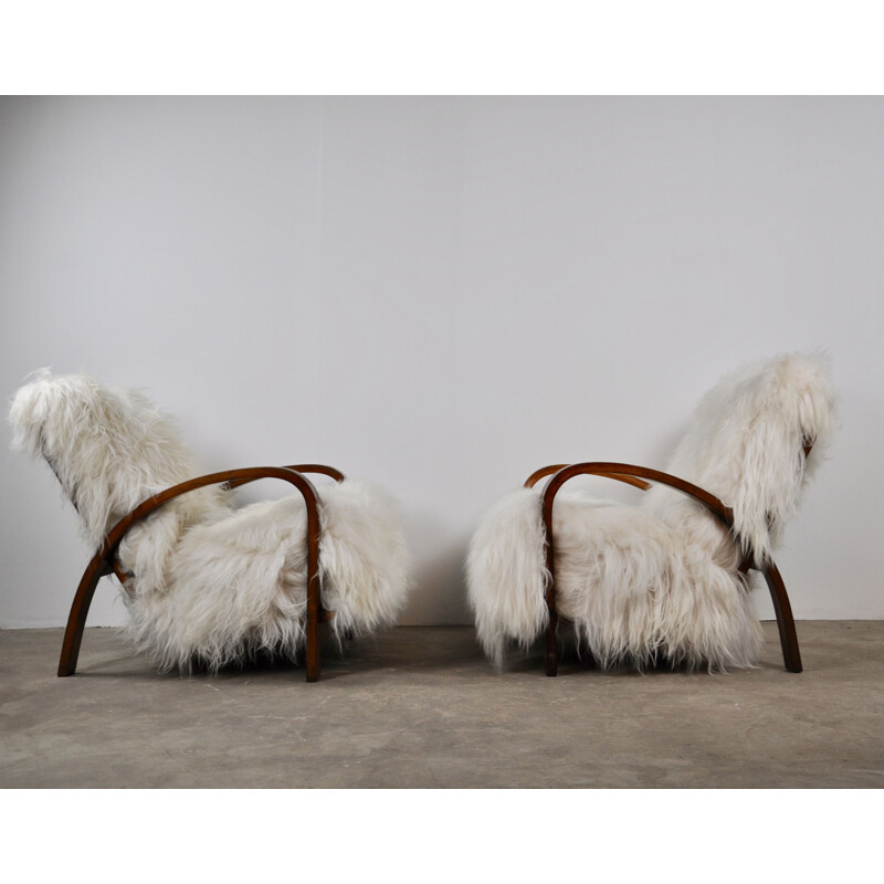 Set of 2 vintage French armchairs in sheepskin 