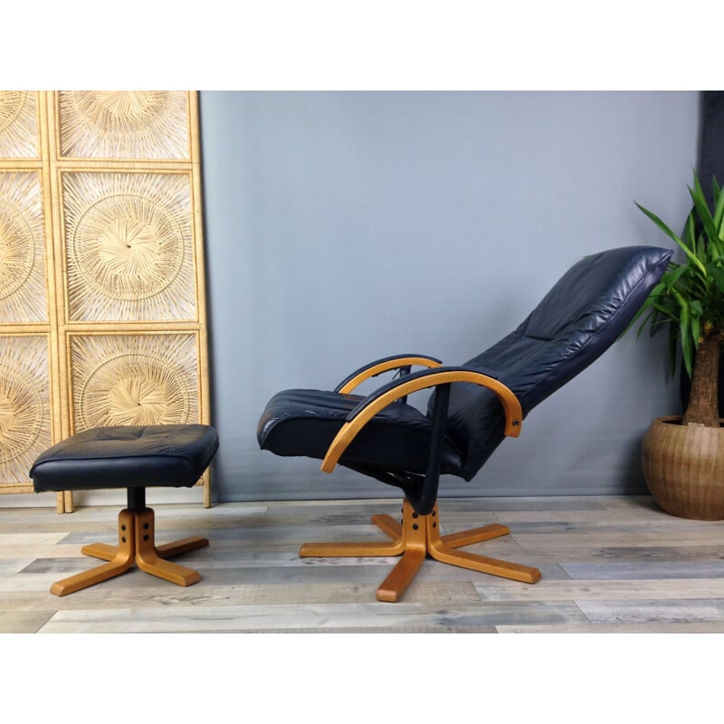 Vintage armchair in leather and wood with ottoman by Unico Denmark