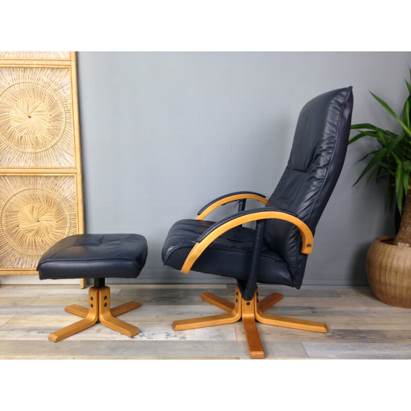 Vintage armchair in leather and wood with ottoman by Unico Denmark