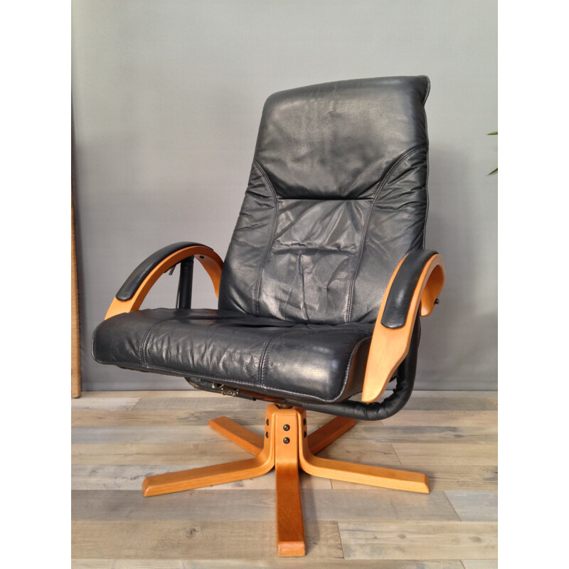 Vintage armchair in leather and wood with ottoman by Unico Denmark