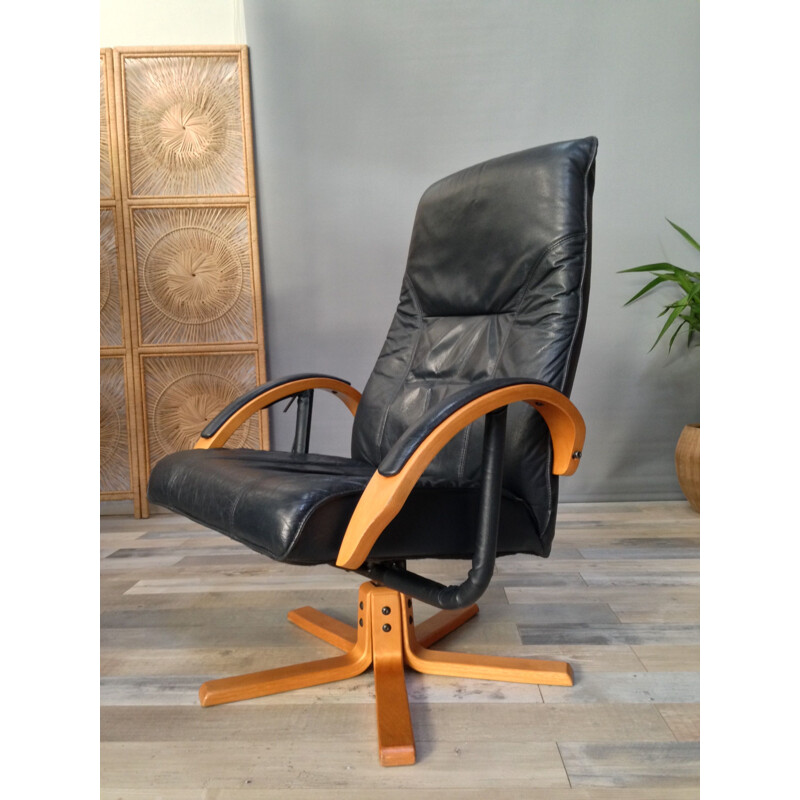 Vintage armchair in leather and wood with ottoman by Unico Denmark