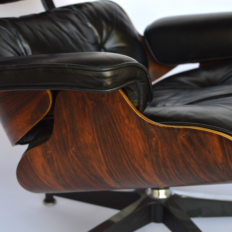 Lounge chair and footstool in rosewood by Eames for Herman Miller 1979