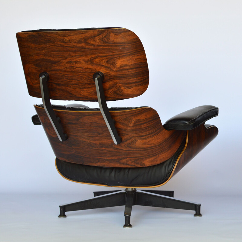 Lounge chair and footstool in rosewood by Eames for Herman Miller 1979