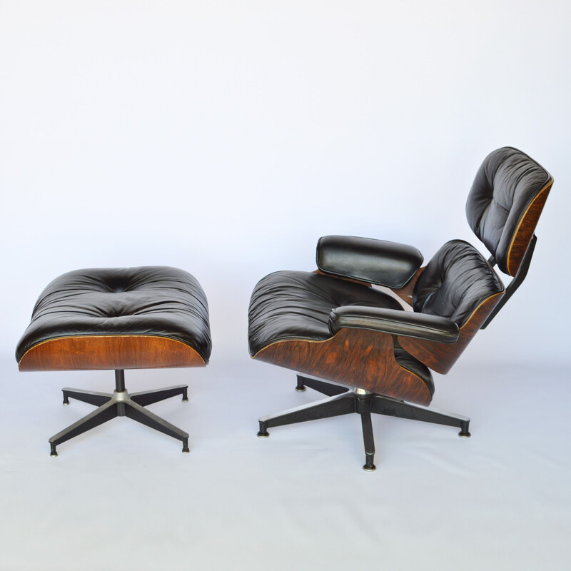 Lounge chair and footstool in rosewood by Eames for Herman Miller 1979