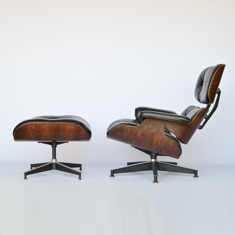 Lounge chair and footstool in rosewood by Eames for Herman Miller 1979