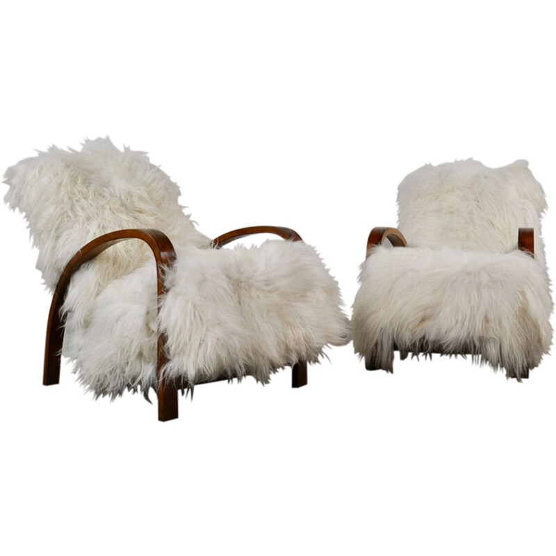 Suite de 2 fauteuils vintage français en peau de mouton 