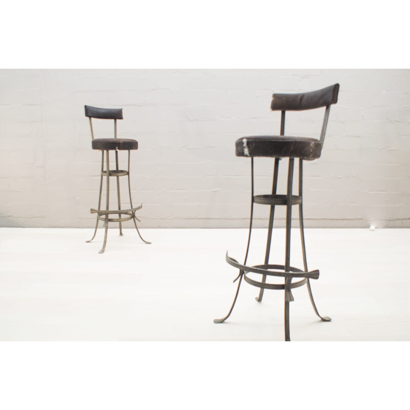 Pair of vintage iron and cowhide bar stools, 1960