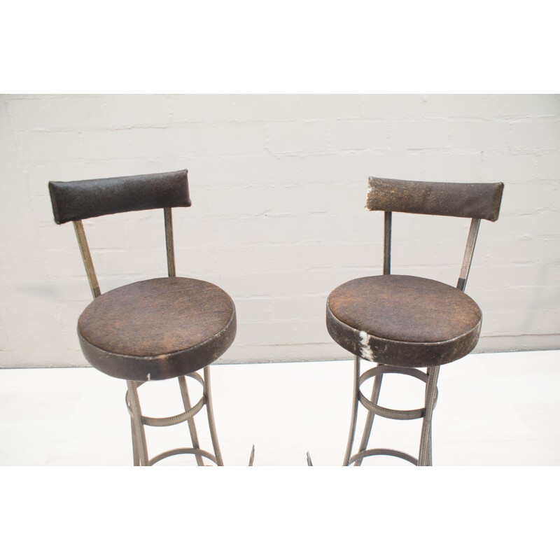 Pair of vintage iron and cowhide bar stools, 1960