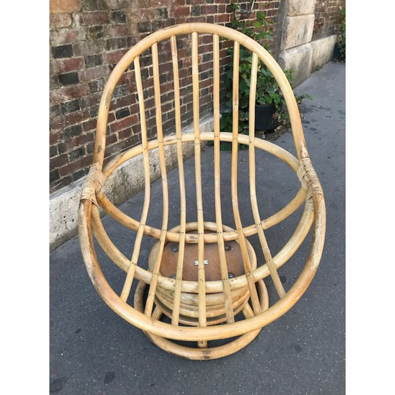 Vintage swivel chair in rattan
