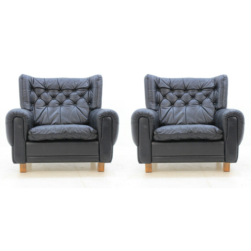 Set of 2 vintage black leather armchairs 1970