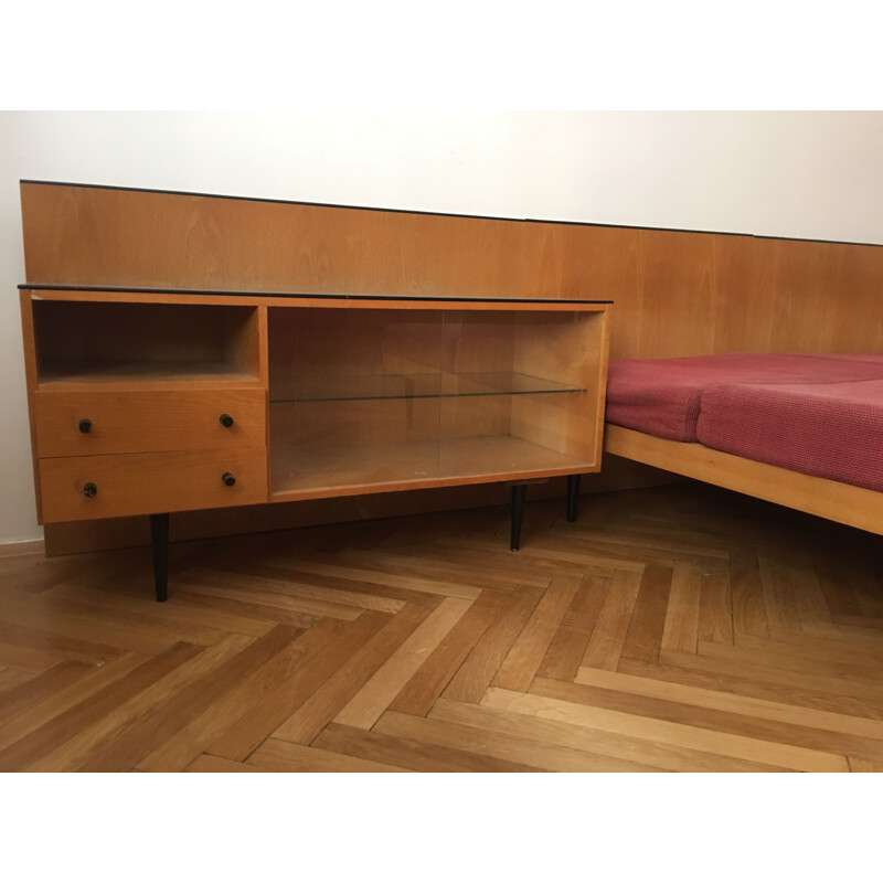 Vintage twin beds with night stands by Mojmir Pozar