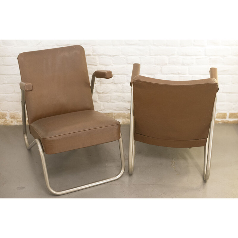 Pair of vintage tubular armchairs in skai and metal 1940