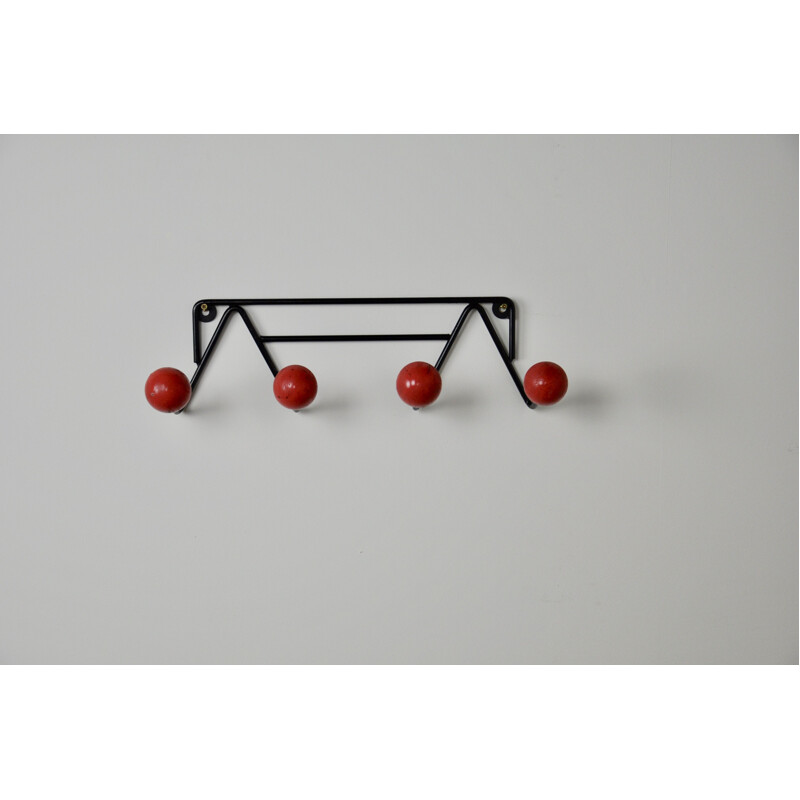 Vintage coat rack with red balls