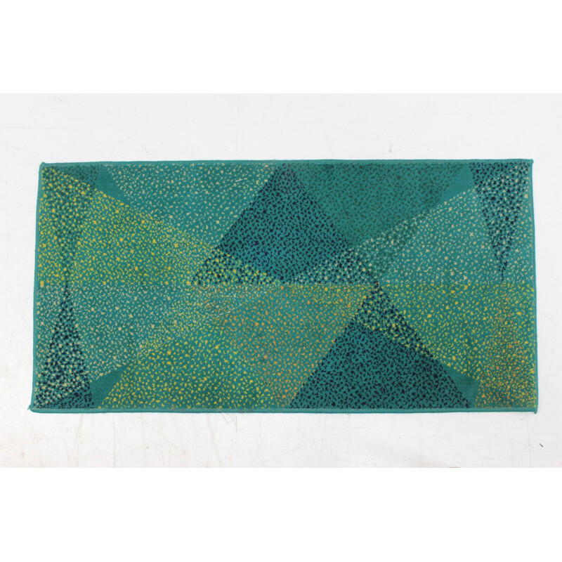 Vintage groen geometrisch tapijt