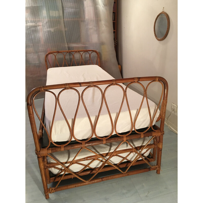 Vintage nesting bed in rattan